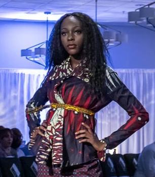 Woman standing on runway in jacket